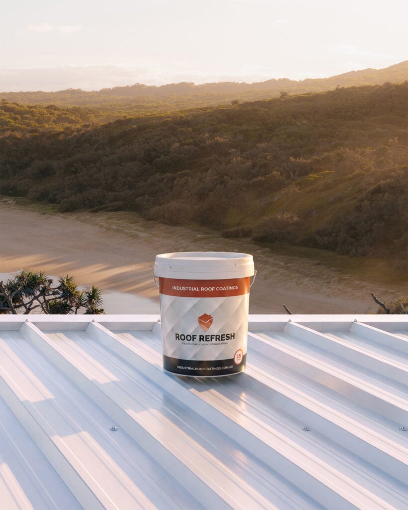 Industrial Roof Coatings Roof Refresh 15-year roof paint on a white metal roof overlooking an Australian beach.