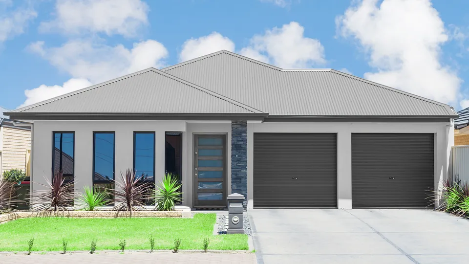 Rendered photograph of a single-storey Australian home, used to preview Industrial Roof Coatings colours on the roof, gutters, fascia, walls and doors.